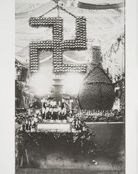 Swastika and wine jug sculptures at the Cloverdale Citrus Fair, Cloverdale, California, 1908