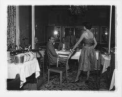 Cocktail dress with spaghetti straps modeled in the "Dramatic Moods" fashion show in the Topaz Room, Santa Rosa, California, 1959