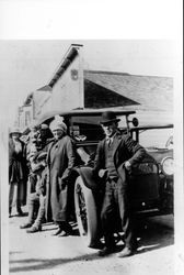 Hattie Brians, Alice Bones and Chick Garcia standing by an automobile