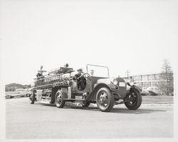 Fire truck being driven by Fire Chief George H. Magee, Santa Rosa, California, 1958