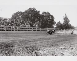 Motorcycle racing at the old dirt race track at the fairgrounds in Petaluma, California, 1960s