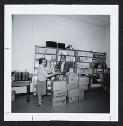 Marie Farrar sorting books