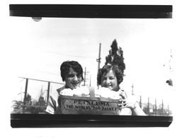 Two women with basket of eggs, Petaluma, California, 1930