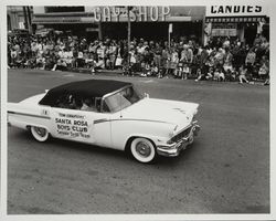 Car preceeding the Santa Rosa Boys Club Senior Drill Team Tom Campions, in the Rose Parade