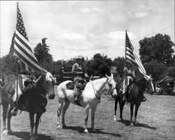 Three members of California Centaurs mounted junior drill team at the Boyes Hot Springs Horse Show in 1946 with Hogback Mountain in the background