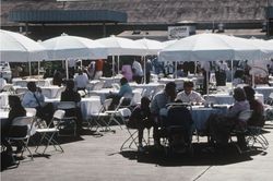 Unidentified people seated at tables at Clover Stornetta's grand opening, September 28, 1991