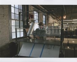 Tim Rhodes wrapping up equipment at Sunset Line & Twine Company in Petaluma, California, Dec. 2006