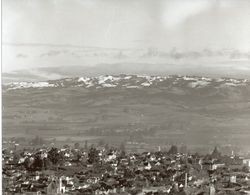 View of Petaluma and Sonoma Mountain dusted with snow looking east from hills west of Petaluma, California, 1947