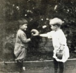 Wilfred Everett Bixby, Jr. boxing an unidentified boy at the Bixby house, 415 Perkins Street, Oakland, California, 1912