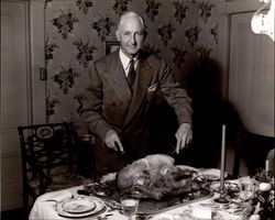 Max Poehlmann carving a turkey, Petaluma, California, about 1947