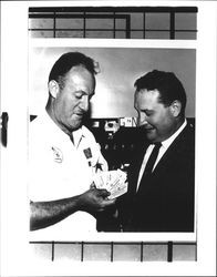 Bob Acorne and Gene Benedetti with tickets for All-Day Breakfast, Petaluma, California, 1955