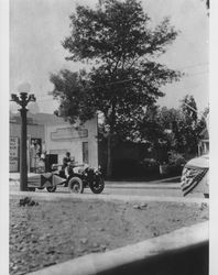 Floats being driven down East Washington Street near the intersection of Copeland Street, Petaluma, California, about 1920