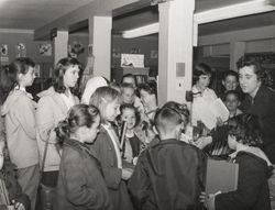 Children gathered around a librarian at the Carnegie Library, Santa Rosa