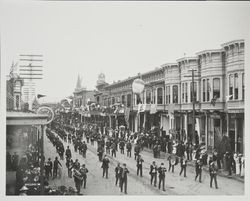 Unknown parade marching down Fourth Street