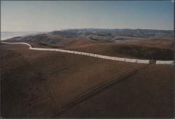 View from a helicopter of Christo's Running Fence looking northwest with Bodega Bay on the left in the background, Bodega Bay, California, September, 1976