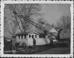 County workers removing a building next to the Cotati Fire Department, Cotati, California, 1958
