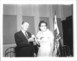 Olga Lavio presenting check to August Lepori, Petaluma, California, 1955