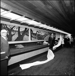 Gordy Soltau looking at paintings by Ruth Dicker at grand opening of the Bank of Sonoma County, Santa Rosa, California, 1973