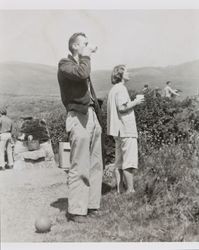 Bill McGregor, Mary Alwes and unidentified people at the beach, about 1955