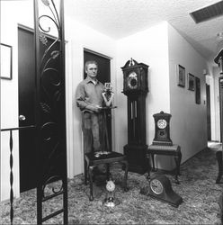 Robert Jordan with his collection of clocks, Santa Rosa, California, 1976