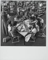 Pam Brown, librarian, with children in the Petaluma Library, Petaluma, California, May 19, 1977