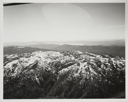 Aerial view of snow covered Mayacmas Mountains and Clear Lake in the distance