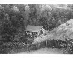 Flora Otis and a child standing on the front porch of her Cazadero, California home, about 1900