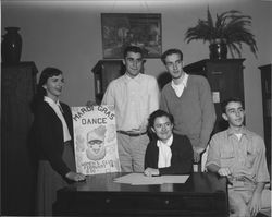 Saint Vincent students with a sign advertising Women's Club Mardi Gras dance, Petaluma, California, 1955