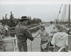 Fred Schram as a Spanish explorer accepting the Bear Flag from a costumed sailor at the opening ceremonies of the Combined Old Adobe Fiesta and Petaluma River Festival of 1986