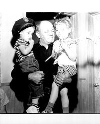 Policeman Herb Vail with two children