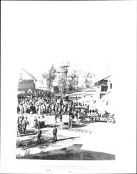 Crowd gathered in the street next to Sonoma Mission for dedication of Camino Real bell, Sonoma, California, 1910