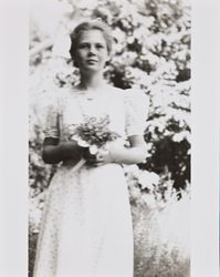 Mary McGregor holding a bouquet of flowers, Santa Rosa, California, about 1936