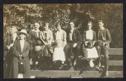 Charles R. Drake sitting on a fence with friends, Sonoma County, California