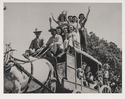 Group of people riding on a stagecoach