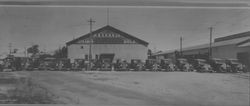 Trucks parked by the Petaluma and Santa Rosa Railroad Company Steamer Gold building, Petaluma, California, about 1939