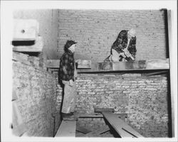 John Schmidt and N.S. Cobb renovating veranda joists at the Old Adobe, Petaluma, California, 1955