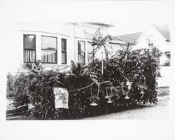 Elks float created with baskets, marigolds, pots of ferns and butterflies in an unknown Rose Parade