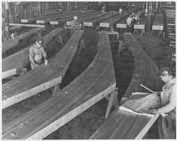 Workers at Speedspace working on laminated beams, 1960s or 1970s