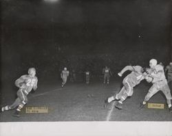 Run play during Petaluma Leghorn game against San Francisco Broncos