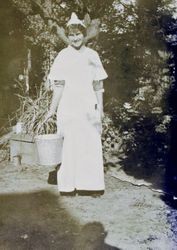 Lily Ramatici stands with a milk pail at the Panama Pacific International Exposition world's fair in San Francisco, 1915