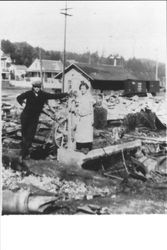 Tom Graham and Louise Morelli looking at aftermath of fire