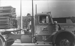 Mary Hitchings driving a Hitchings Lumber truck in the Cloverdale Citrus Fair Parade, Clovedale, California, 1981