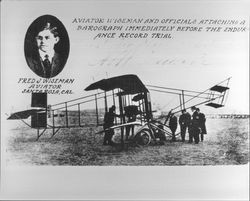 Aviator Wiseman and officials attaching a barograph immediately before the endurance record trial