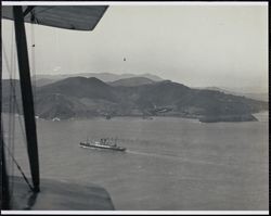 Aerial view of an unidentified passenger ship leaving San Francisco Bay, 1920s