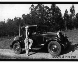 Russell Nissen posing in front of his car July 10, 1932 in Petaluma, California