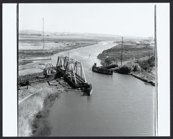 Railroad swing bridge opened for river traffic