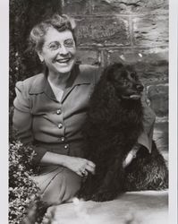 Dagny Juell posing for a photograph with one of her dogs, Santa Rosa, California, about 1949