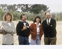 Al Bono and Dawn Roe of the California Cooperative Creamery standing with an unidentified man and woman at a hot air balloon event, 1994