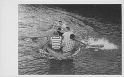 Fire fighters in a four-man, Old Adobe Fiesta, rowboat race, Petaluma, California, August 1969