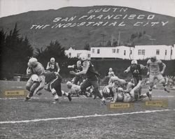 Run play during Petaluma Leghorns game against South San Francisco Windbreakers